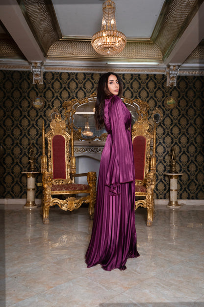 Burgundy pleated jumpsuit with gold chain belt with sleeves