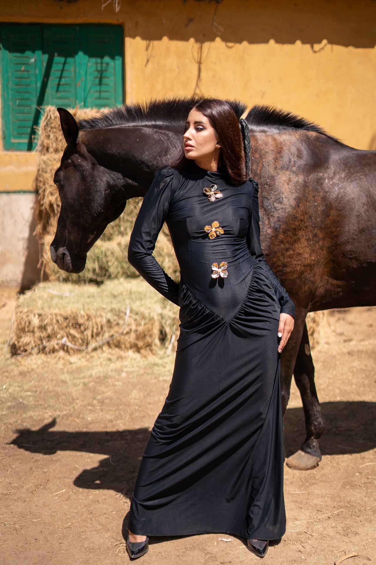 Black v waist dress with gold flowers